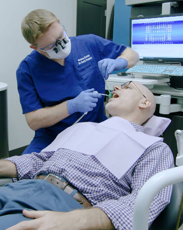 Dr. Traynor examining a patient