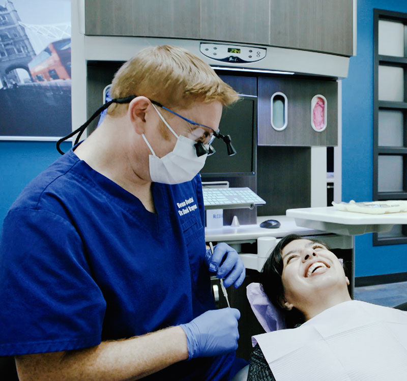 Dr. Traynor with a laughing female patient